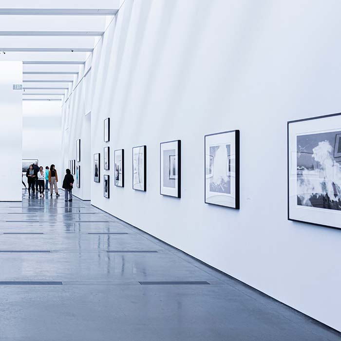 an art gallery with photos on the wall